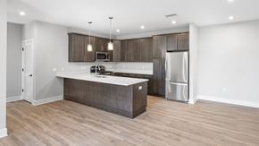 Bordentown apartment for rent - a kitchen with a large island and a stainless steel refrigerator