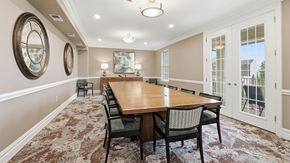Whitehall apartment for rent - Multipurpose room with a long wooden table and chairs.