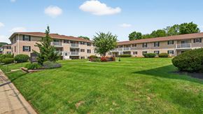 Bethlehem apartment for rent - Apartment complex with green lawn and trees.