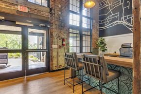 Atlanta apartment for rent - a dining room with a table and chairs in front of a window