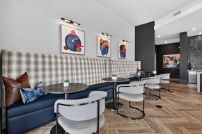 Charlotte apartment for rent - A modern dining area with a checkered booth and chairs.