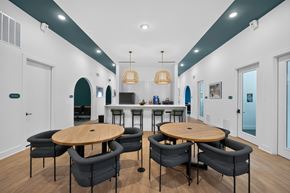 Jacksonville apartment for rent - A modern dining room with a round table and chairs.