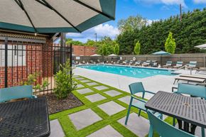 Marietta apartment for rent - A pool area with a table and chairs.