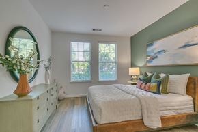 Atlanta apartment for rent - a bedroom with a bed and a mirror
