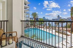 Jacksonville apartment for rent - A balcony with a pool and a view of the city.