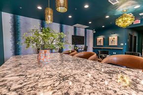 Atlanta apartment for rent - A dining room with a marble table and chairs.