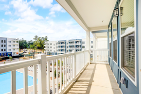 Raleigh apartment for rent - a balcony with a view of a pool and apartment buildings