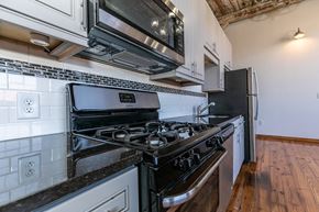 Marietta apartment for rent - a kitchen with a stove and a microwave