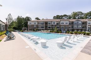 Lawrenceville apartment for rent - our apartments have a large pool with chairs and umbrellas