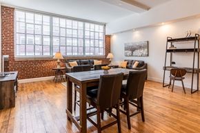 Winston-Salem apartment for rent - a dining room with a table and chairs in front of a large window