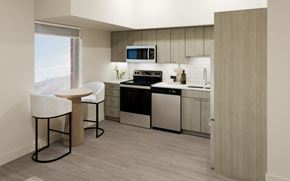 Halifax apartment for rent - A modern kitchen with a black stove top oven and a microwave above the stove.
