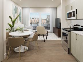 Halifax apartment for rent - A modern kitchen with a dining table and chairs.