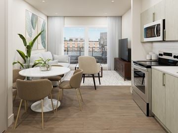 Halifax apartment for rent - A modern kitchen with a dining table and chairs.