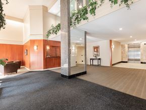 Halifax apartment for rent - A large open space with a carpeted floor and wooden walls.