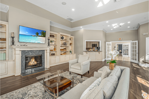 Glen Mills apartment for rent - A living room with a fireplace and a flat screen TV mounted above it.