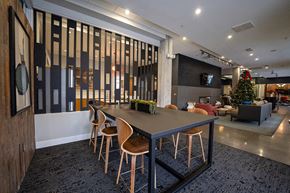 Denver apartment for rent - a dining room table with chairs in a lobby