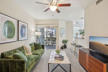 Tampa apartment for rent - A living room with a green couch and a coffee table.
