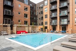 La Grange apartment for rent - A swimming pool in front of apartment buildings.