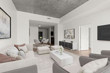 Seattle apartment for rent - A living room with a grey couch and a coffee table.