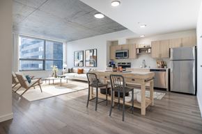 Seattle apartment for rent - A modern kitchen with a dining table and chairs.