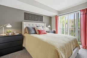 Pasadena apartment for rent - A bedroom with a large bed and a black dresser.