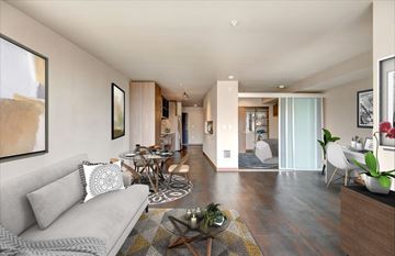Seattle apartment for rent - A modern living room with a grey sofa and a coffee table.