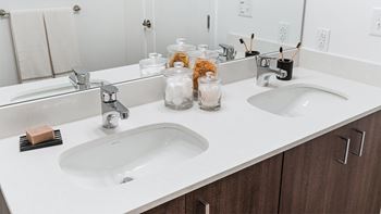 Dual vanities with ample bathroom storage*