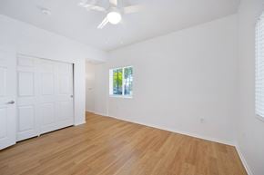 Chula Vista apartment for rent - A room with a white door and a window with a view of trees.
