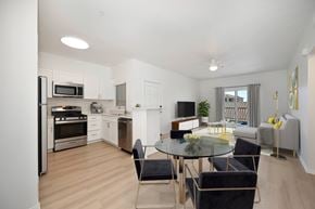Chula Vista apartment for rent - A modern kitchen with a glass table and chairs.