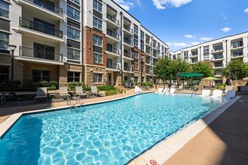 Charlotte apartment for rent - A swimming pool in front of apartment buildings.