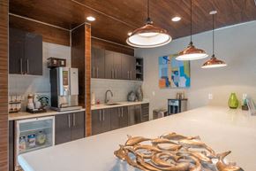 Austin apartment for rent - a kitchen with stainless steel appliances and a white counter top
