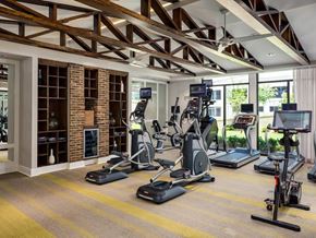 Atlanta apartment for rent - A gym with a variety of exercise equipment including treadmills, stationary bikes, and elliptical machines.