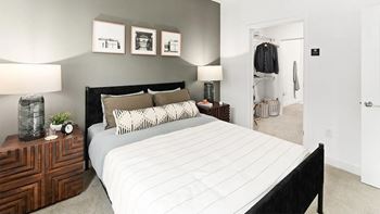 Large bedrooms with carpeted flooring and pass through closets with built-in shelving*