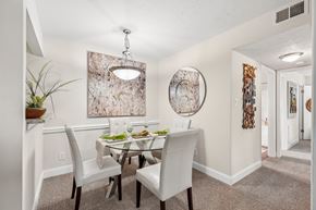 Germantown apartment for rent - A dining room with a table set for two and a large abstract painting on the wall.