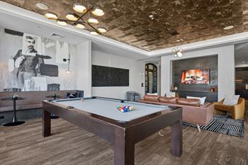 Epic game room with pool table, tvs, and hangout space