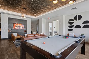 Epic game room with pool table, tvs, and hangout space