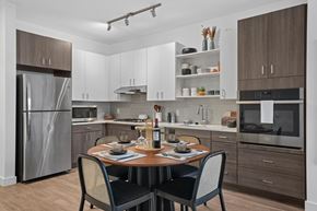 Framingham apartment for rent - A modern kitchen with a table set for two.