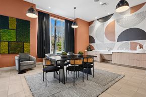 Framingham apartment for rent - A dining room with a table set for four.