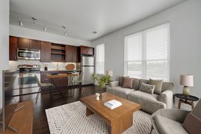 Nashville apartment for rent - A modern kitchen with a breakfast table and a couch.