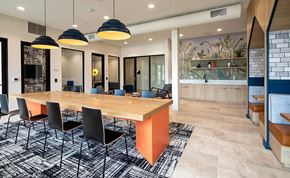 Fullerton apartment for rent - a dining room with a wooden table and chairs