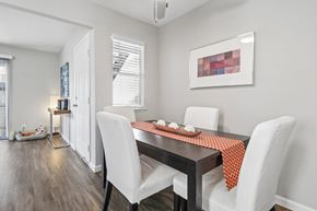 San Jose apartment for rent - A dining room with a table set for two.