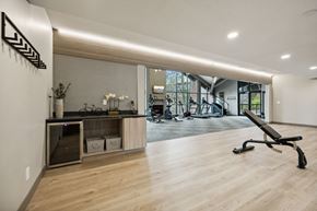 Eden Prairie apartment for rent - a gym with a desk and a chair in the middle of a room