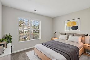 Cornelius apartment for rent - A bedroom with a large bed and a painting on the wall.