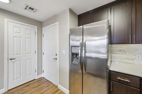 Walnut Creek apartment for rent - A kitchen with a stainless steel refrigerator and white doors.