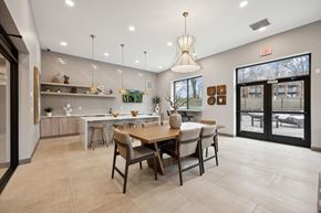 Eden Prairie apartment for rent - the gathering room and kitchen of a home with a dining table and chairs