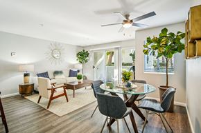 San Clemente apartment for rent - A modern dining room with a glass table and chairs.
