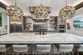 Eden Prairie apartment for rent - A modern kitchen with a marble table and chairs.