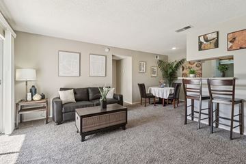 San Antonio apartment for rent - A living room with a grey carpet and furniture.