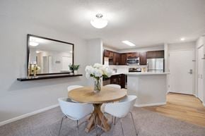 Woodbury apartment for rent - a kitchen and dining room with a table and chairs