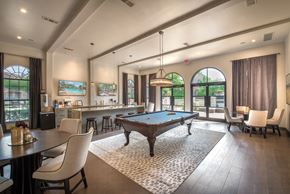 Mckinney apartment for rent - A large room with a pool table and a bar.